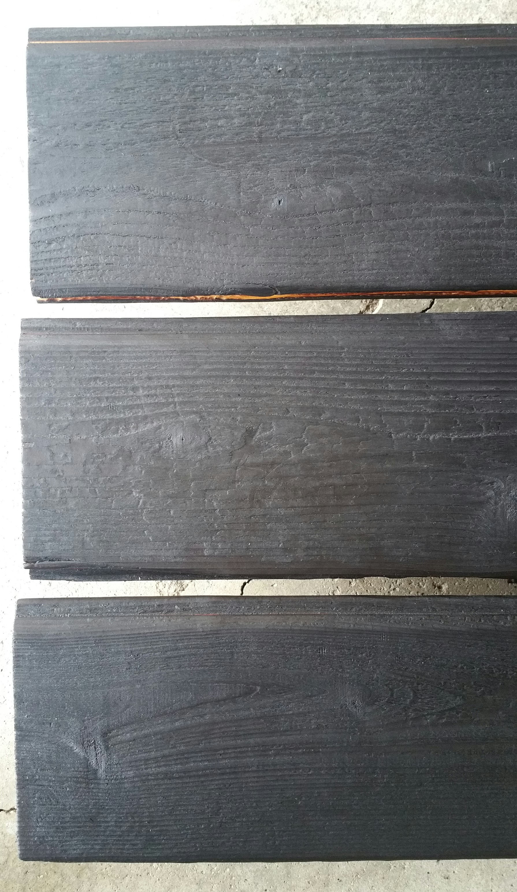 oiled-charred-boards-on-the-stack-to-dry