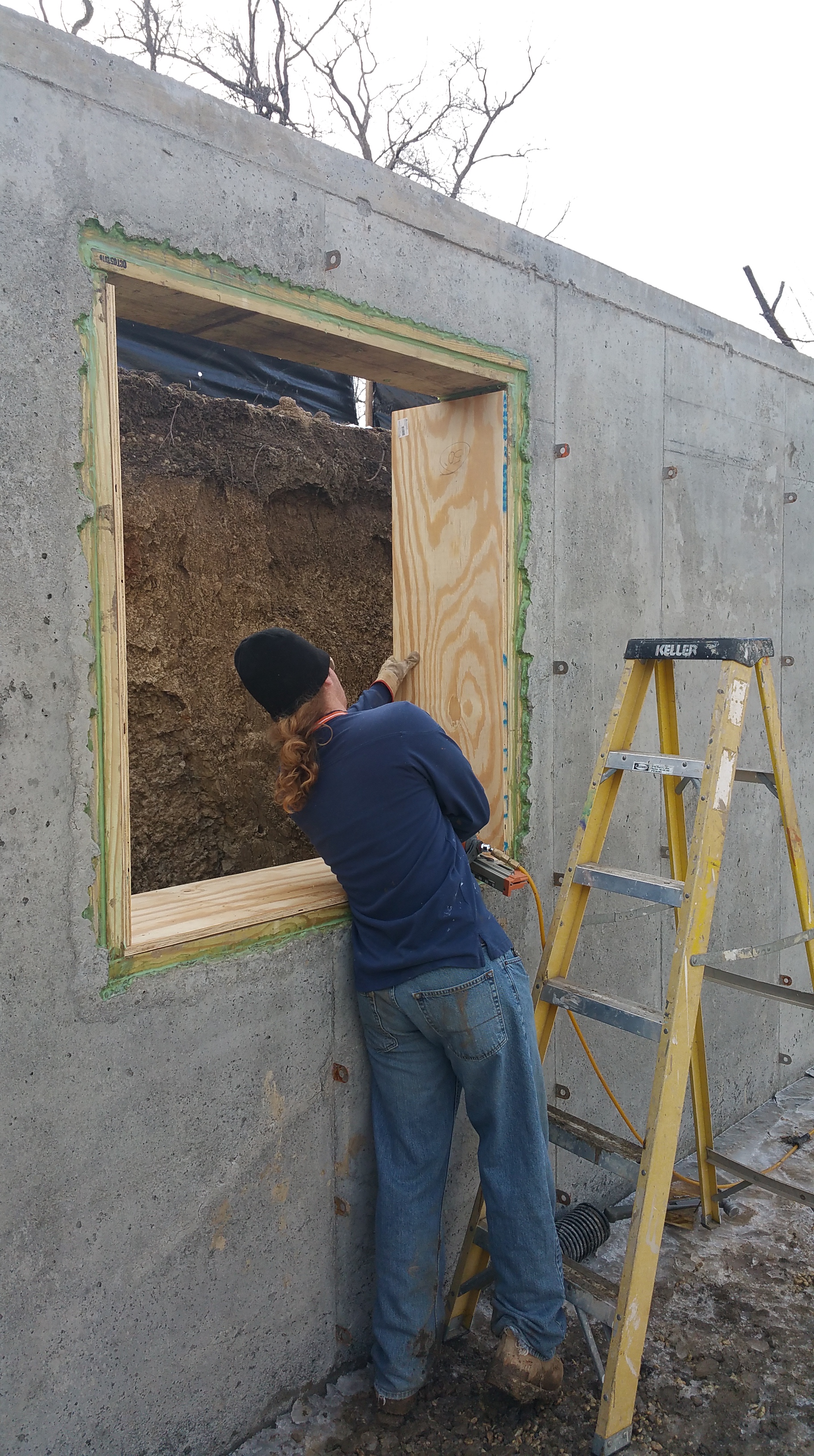 nils-installing-basement-window-bucks