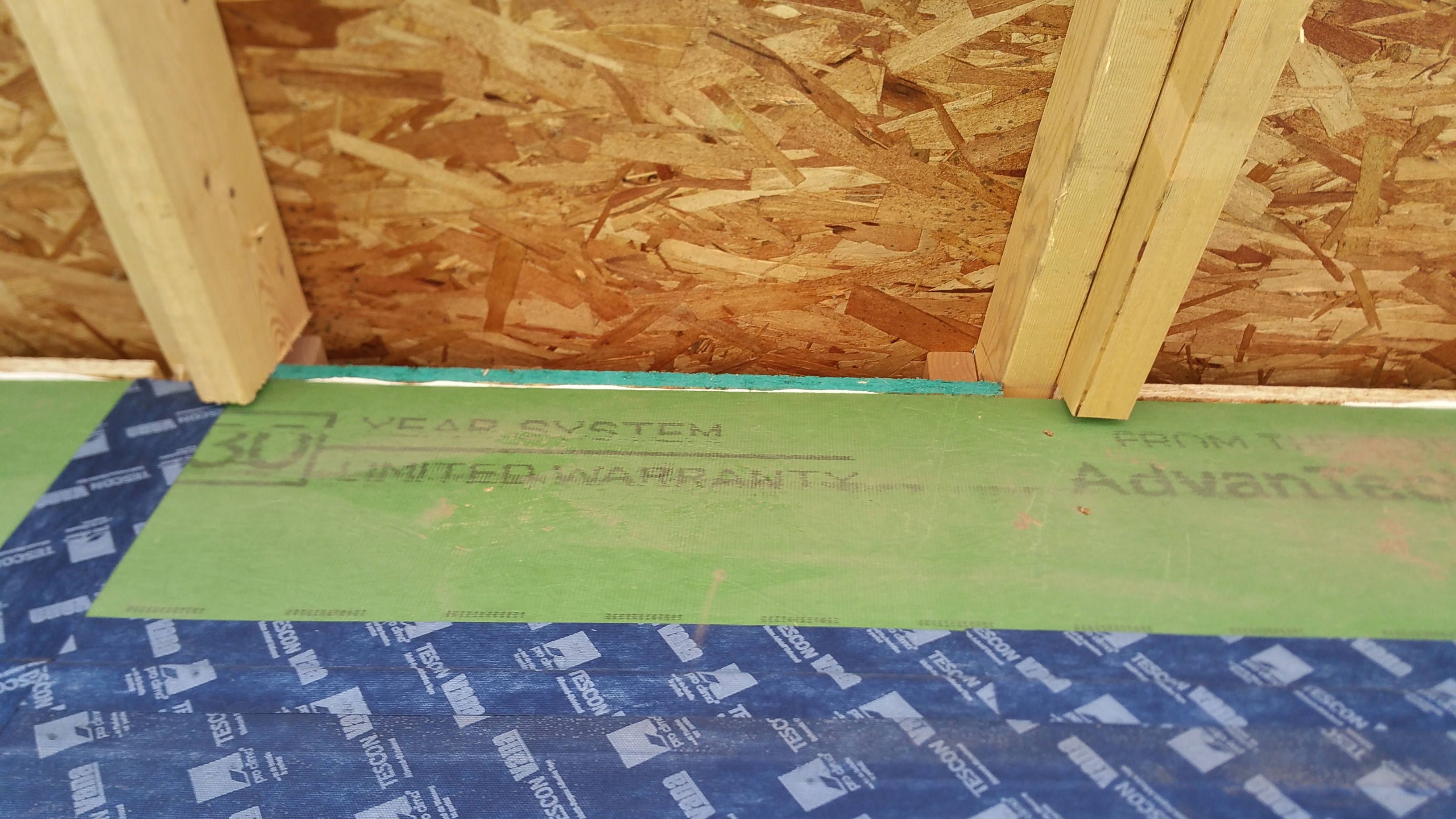 close up of OSB insulation chutes from outside