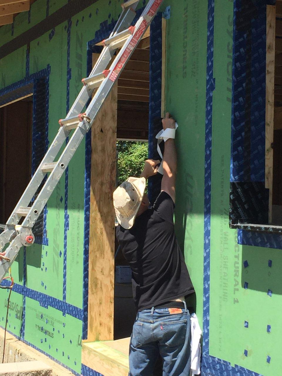 taping side of door buck - south side