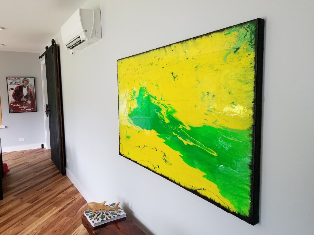 heat pump mounted on wall with artwork